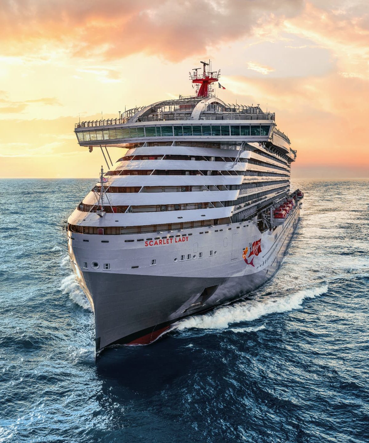 Scarlet Lady sailing on open ocean at sunset